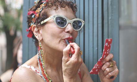 Hot Granny putting on lipstick