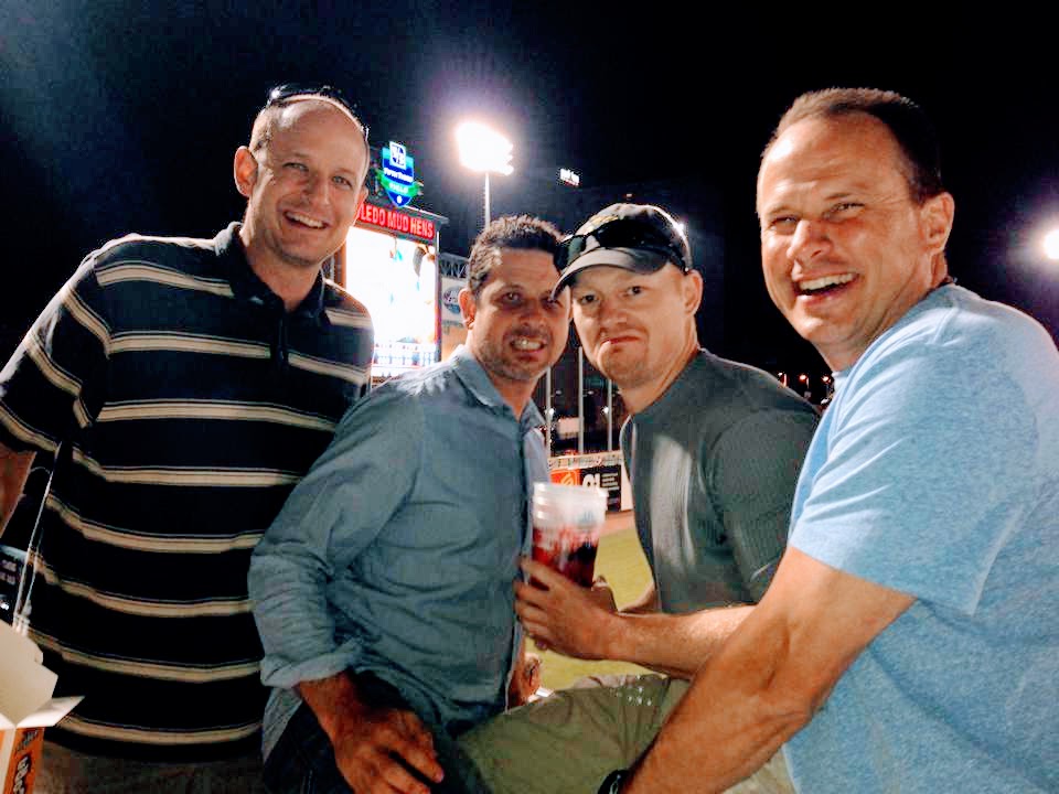 A hunkly group of friends at the ballgame.